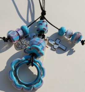 Casual necklace with glass beads and charms.  